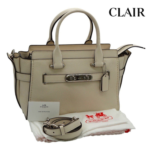 コーチ ショルダーバッグ 2WAYハンドバッグ シグネチャー ターンロック 白 ホワイト レディース