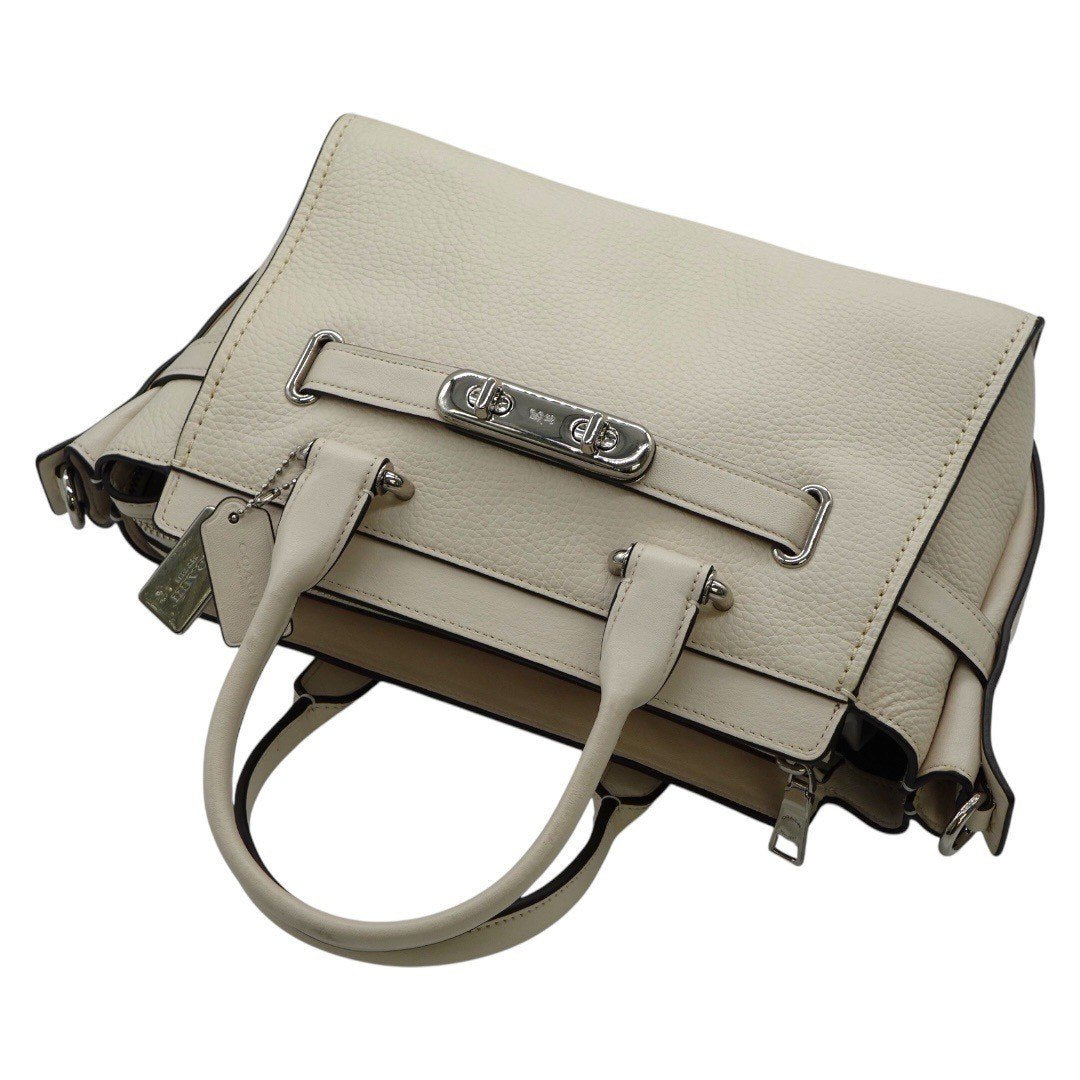 コーチ ショルダーバッグ 2WAYハンドバッグ シグネチャー ターンロック 白 ホワイト レディース